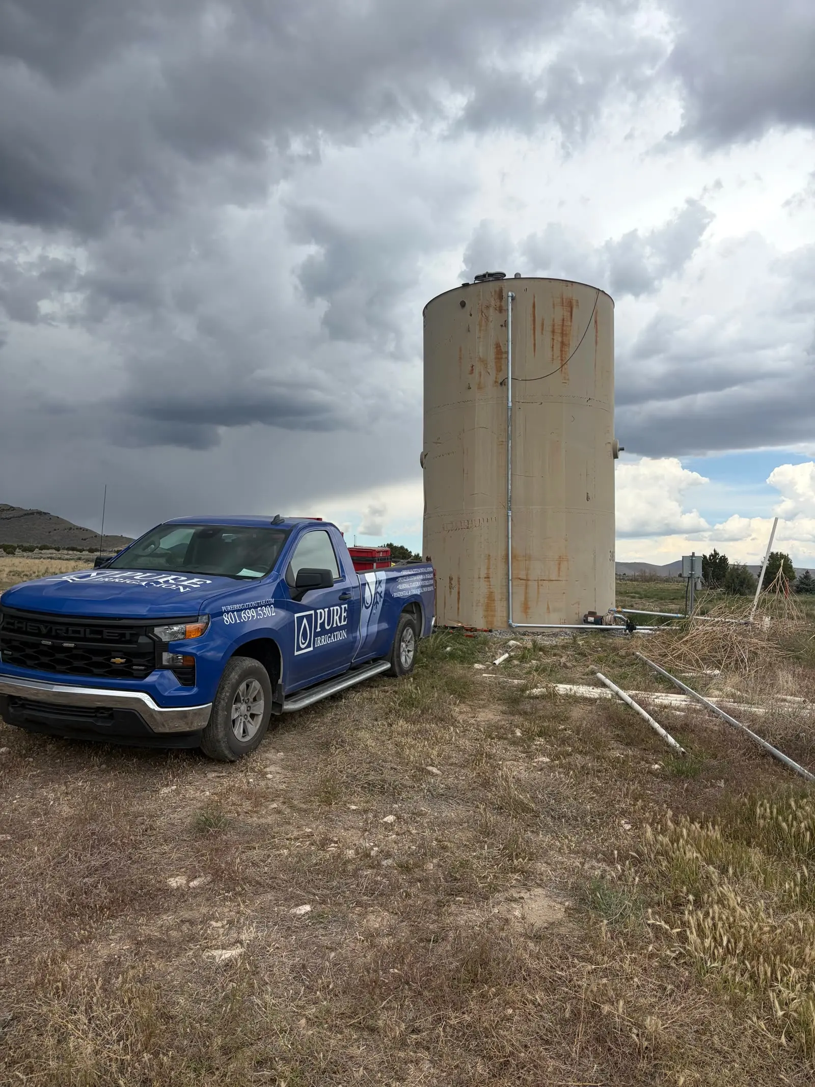 A Pure Irrigation branded truck on a job site in rural Utah